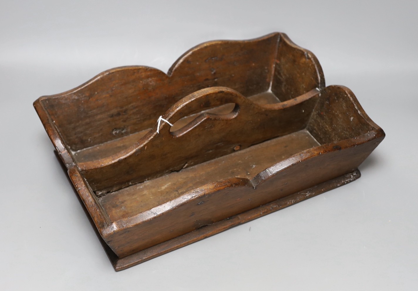 A 19th century rosewood tea caddy and a mahogany cutlery tray